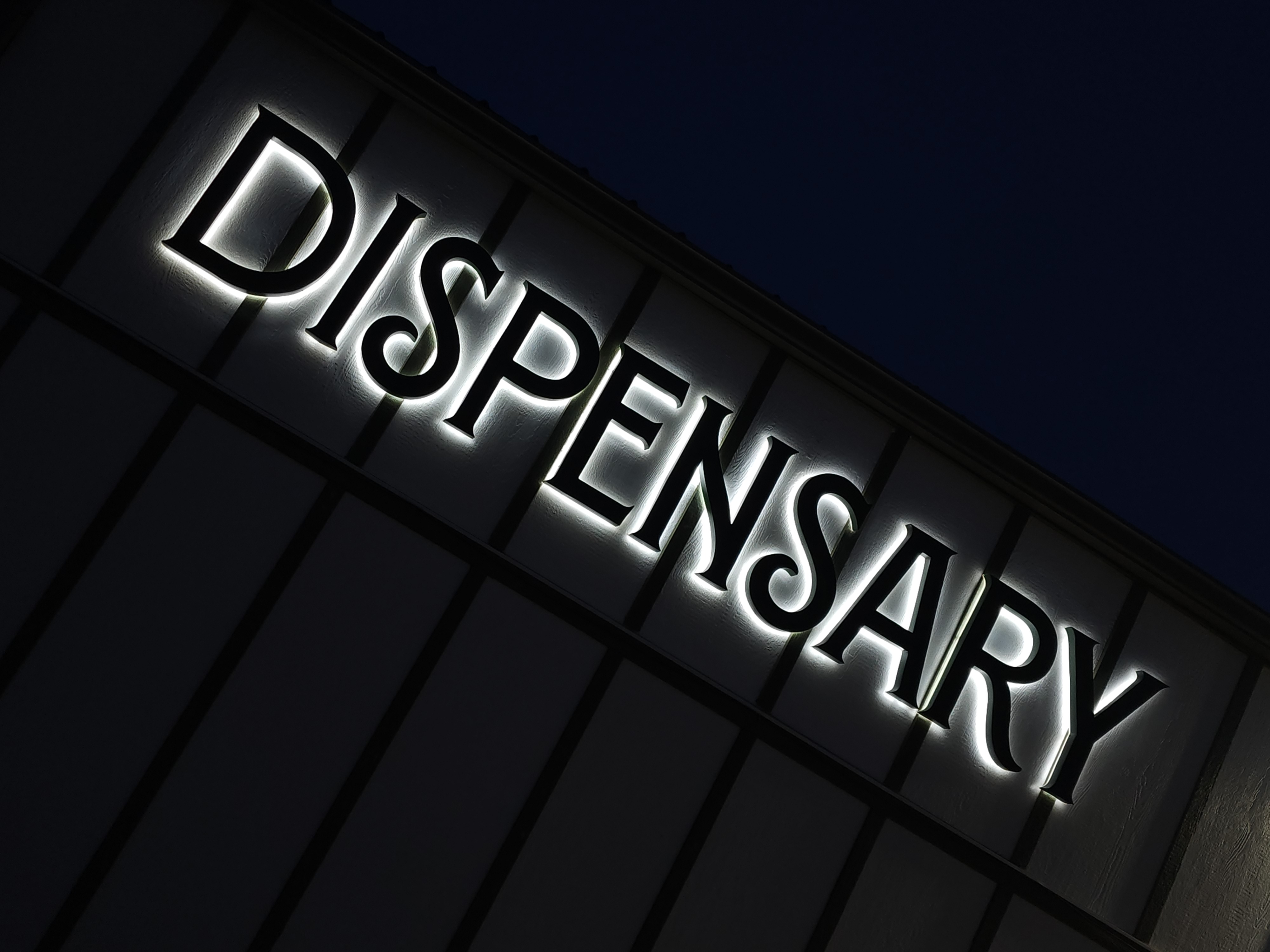 Halo-lit channel letter sign at night